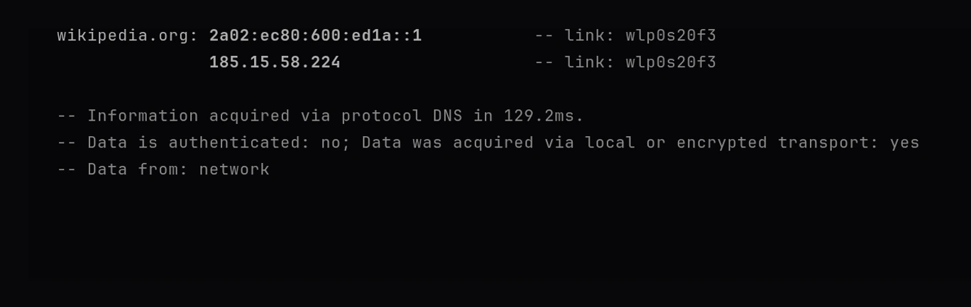 resolvectl query wikipedia.org returning two addresses over link wlp0s20f3, with a line reading: Data is authenticated: no; Data was acquired via local or encrypted transport: yes